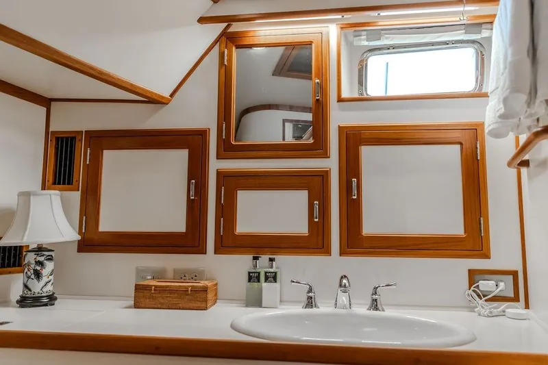 Slide: The Image of Luxurious Dettling Motoryacht 2012 bathroom with wooden cabinets and elegant sink. - 39