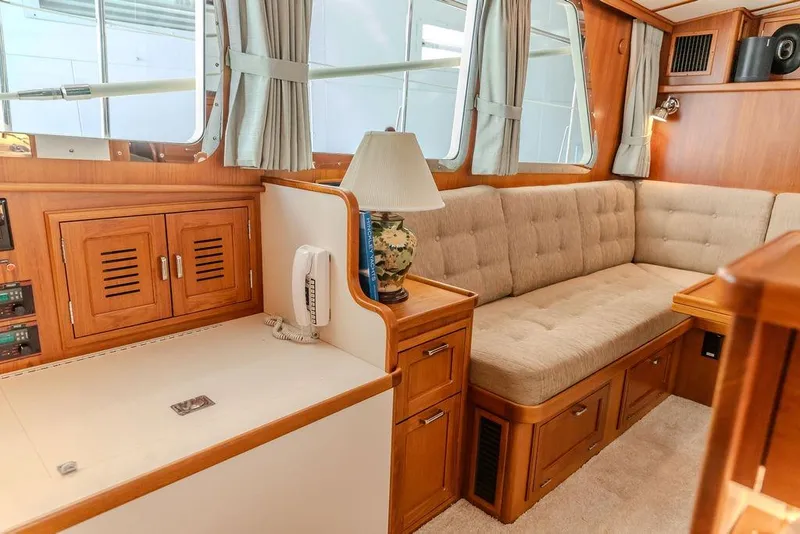 Slide: The Image of Luxurious 2012 Dettling Motoryacht interior with plush seating and elegant wood finishes. - 26