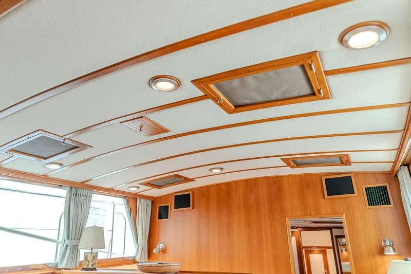 Slide: The Image of Interior of 2012 Dettling Motoryacht with wooden accents and ceiling lights. - 31