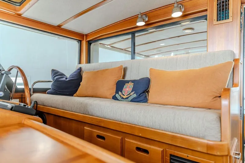 Slide: The Image of Luxurious interior of 2012 Dettling Motoryacht with plush seating and decorative pillows. - 17