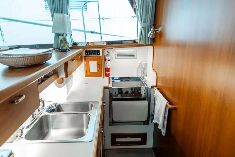 Slide: The Image of Luxurious 2012 Dettling Motoryacht kitchen with modern appliances and elegant wood finishes. - 27