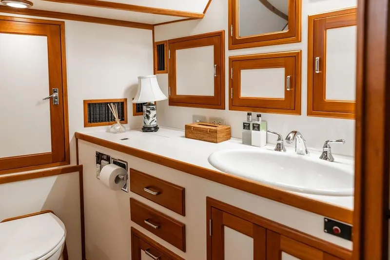 Slide: The Image of Luxurious bathroom on 2012 Dettling Motoryacht with wooden accents and modern fixtures. - 37