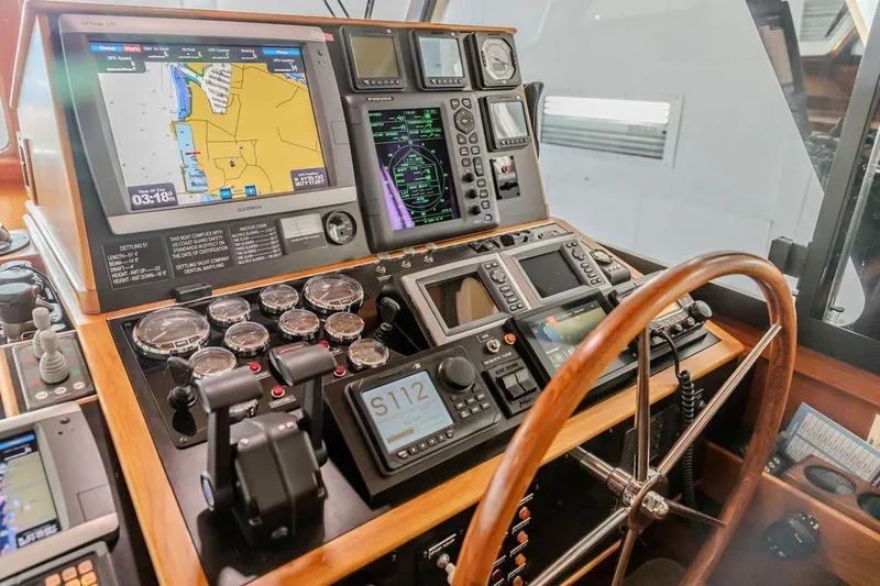 Slide: The Image of Control panel of a 2012 Dettling Motoryacht with navigation and communication equipment. - 15