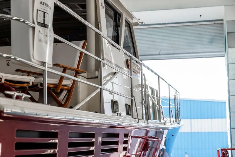 Slide: The Image of 2012 Dettling Motoryacht in a marina, showcasing sleek design and polished finish. - 11