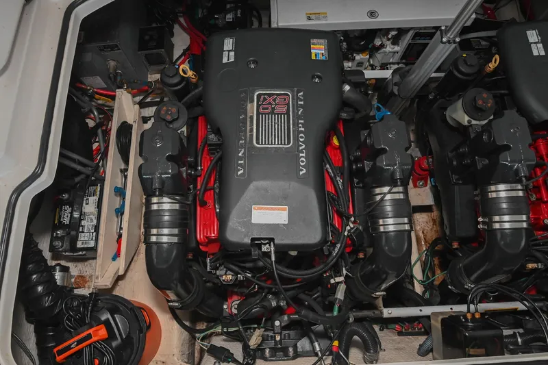 Slide: The Image of Engine compartment of a 2009 Regal 3060 Window Express boat, featuring Volvo Penta engines. - 49
