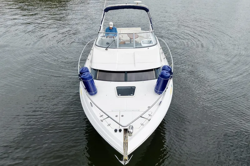 Slide: The Image of 2009 Regal 3060 Window Express boat cruising on calm water, top view. - 6