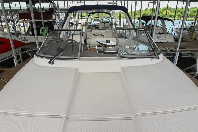 Slide: The Image of 2009 Regal 3060 Window Express boat docked in a marina, front view. - 29