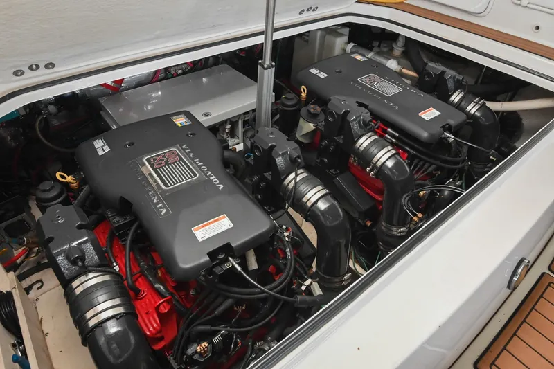 Slide: The Image of Engine compartment of a 2009 Regal 3060 Window Express boat with dual Volvo Penta engines. - 48