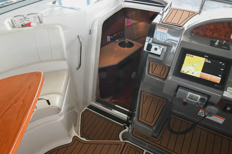 Slide: The Image of 2009 Regal 3060 Window Express interior with navigation system and seating area. - 30