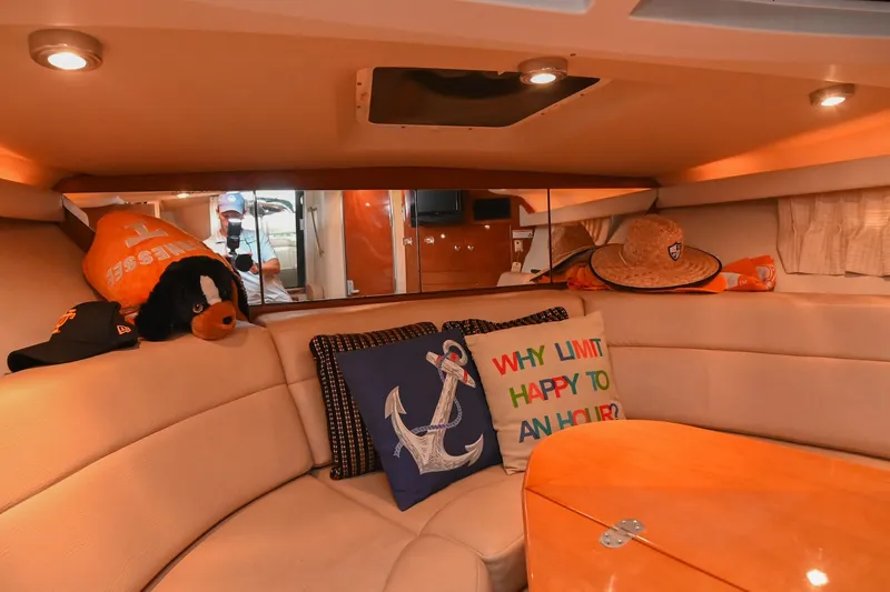 Slide: The Image of Cozy interior of 2009 Regal 3060 Window Express with decorative pillows and hats. - 39