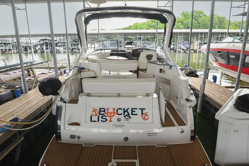 Slide: The Image of 2009 Regal 3060 Window Express boat docked at marina, rear view. - 5