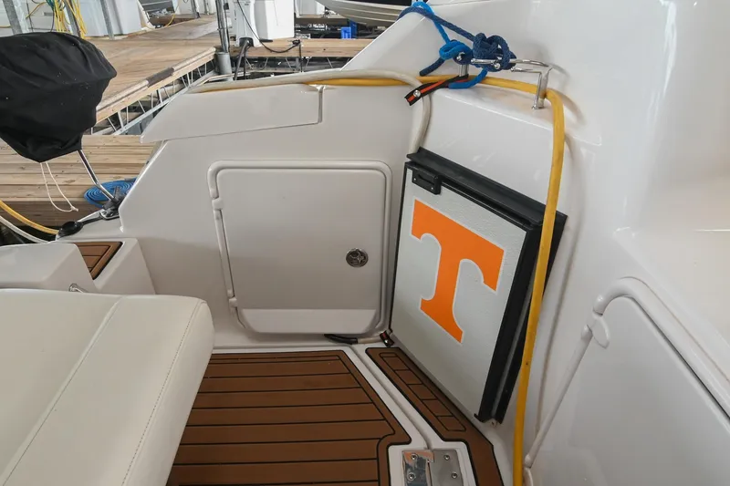 Slide: The Image of 2009 Regal 3060 Window Express boat interior with Tennessee logo on cooler. - 11