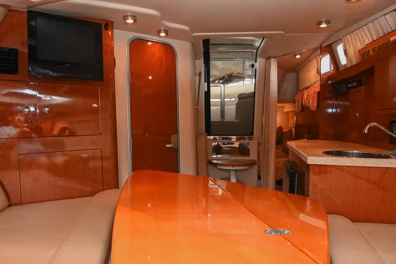 Slide: The Image of Interior of 2009 Regal 3060 Window Express yacht with wood finishes and modern amenities. - 33