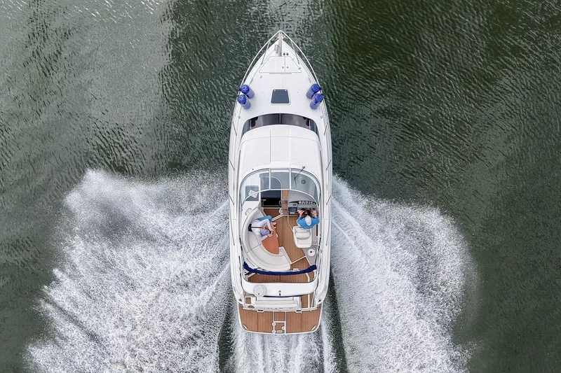 Slide: The Image of Aerial view of 2009 Regal 3060 Window Express cruising on water. - 2