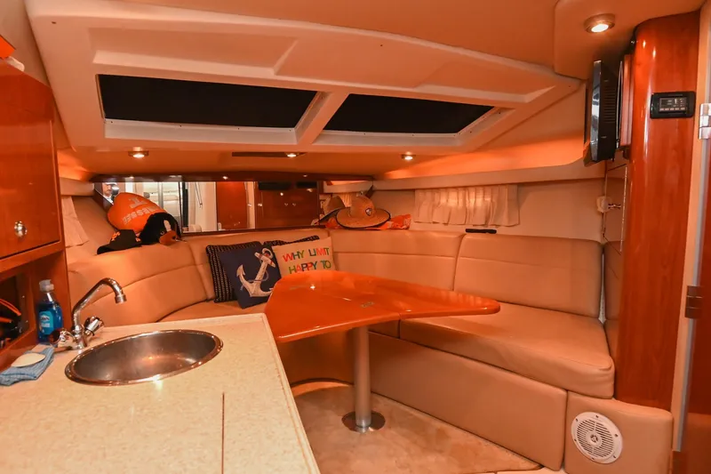Slide: The Image of Interior of 2009 Regal 3060 Window Express yacht with cozy seating and kitchenette. - 36