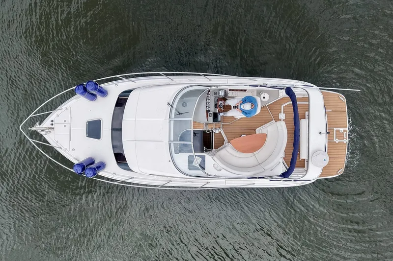 Slide: The Image of Aerial view of 2009 Regal 3060 Window Express boat on water. - 9