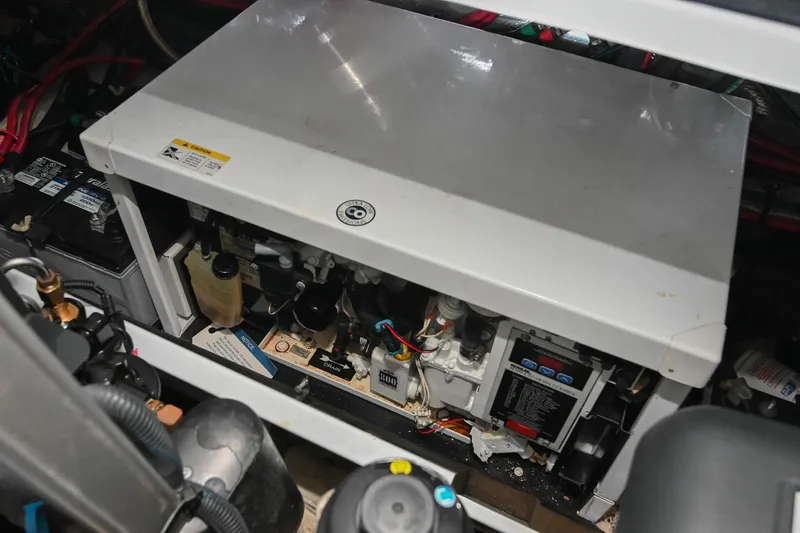 Slide: The Image of Engine compartment of a 2009 Regal 3060 Window Express boat, showing mechanical components. - 51