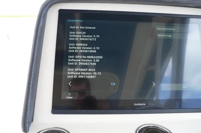Slide: The Image of Garmin device display on 2018 Grady-White Freedom 325 boat, showing software versions and unit IDs. - 36