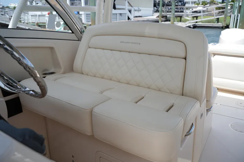 Slide: The Image of Luxurious seating on a 2018 Grady-White Freedom 325 boat, featuring elegant diamond stitching. - 32