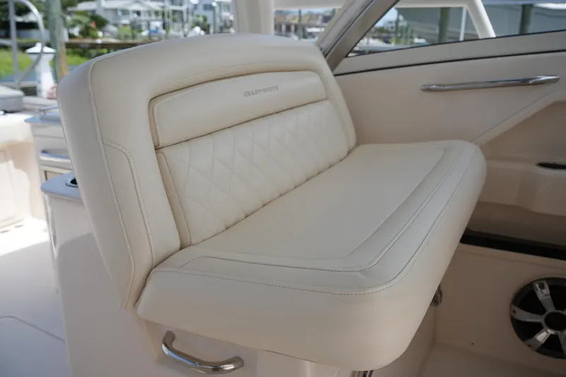 Slide: The Image of Luxurious seating on 2018 Grady-White Freedom 325 boat, featuring elegant white upholstery. - 29