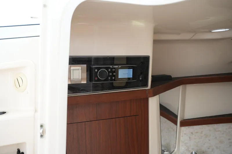 Slide: The Image of Interior view of 2018 Grady-White Freedom 325 boat with modern audio system. - 45