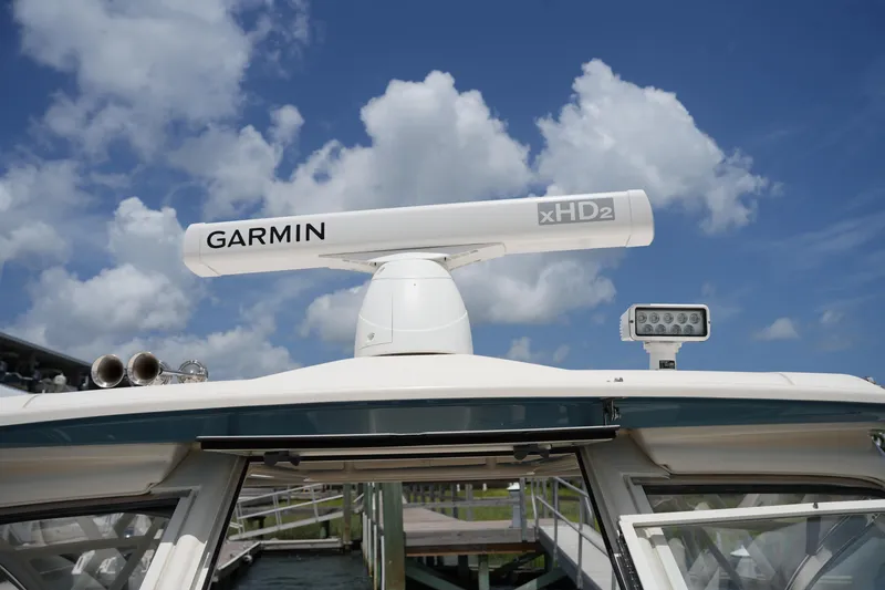 Slide: The Image of 2018 Grady-White Freedom 325 boat with Garmin xHD2 radar under blue sky. - 53