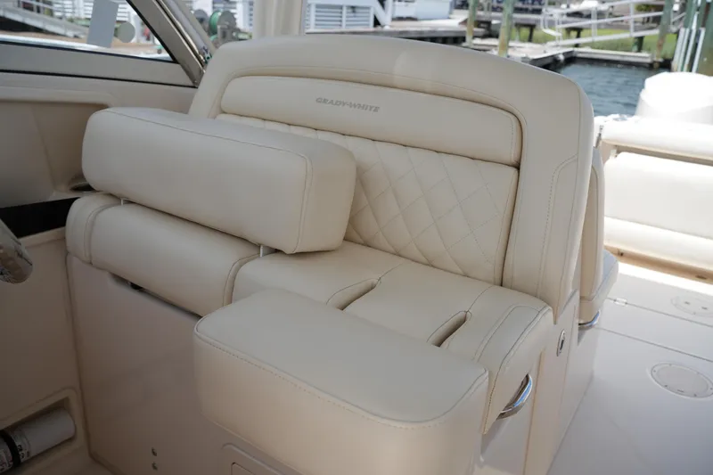 Slide: The Image of Luxurious seating on 2018 Grady-White Freedom 325 boat, featuring elegant beige upholstery. - 31