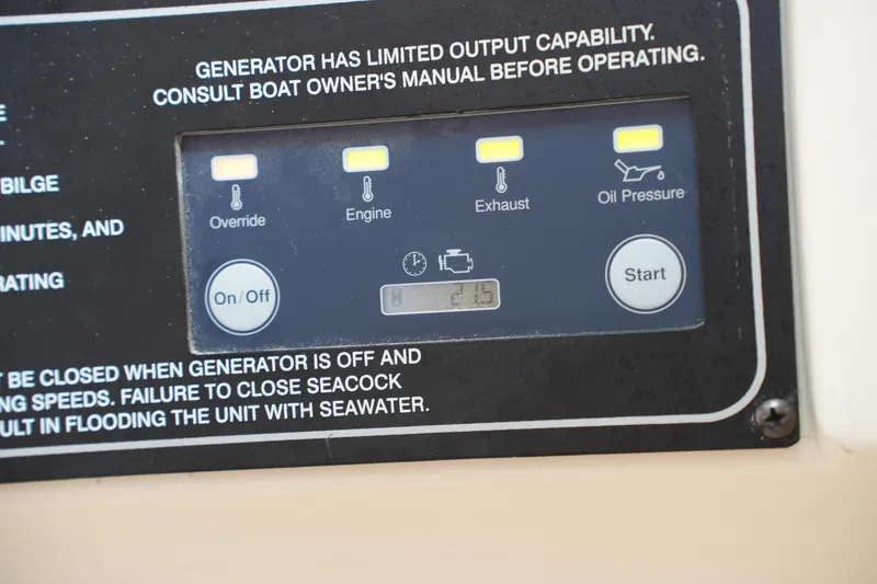 Slide: The Image of Control panel of a 2018 Grady-White Freedom 325 boat, showing generator indicators. - 50
