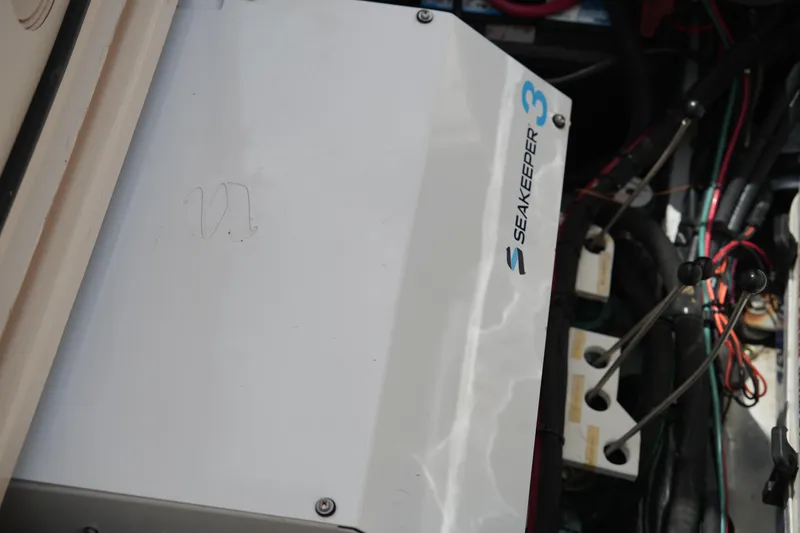 Slide: The Image of Seakeeper 3 gyroscope in 2018 Grady-White Freedom 325 boat engine compartment. - 23