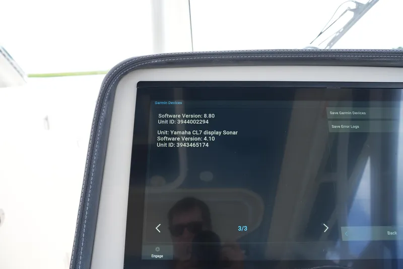 Slide: The Image of Garmin device screen on 2018 Grady-White Freedom 325 boat displaying software versions. - 38