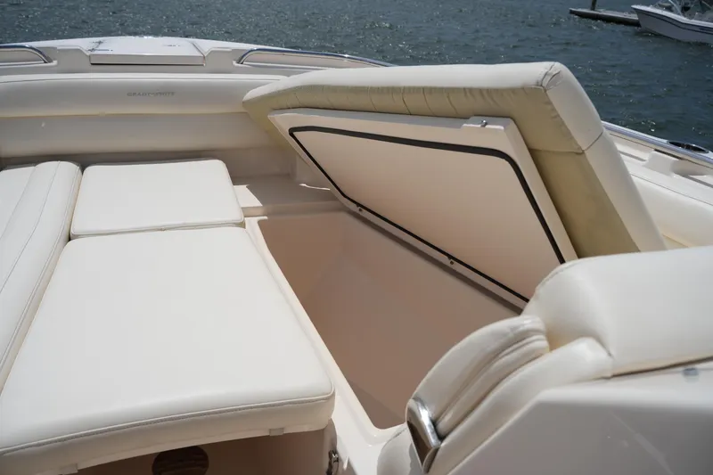Slide: The Image of 2018 Grady-White Freedom 325 boat interior with open storage compartment. - 52