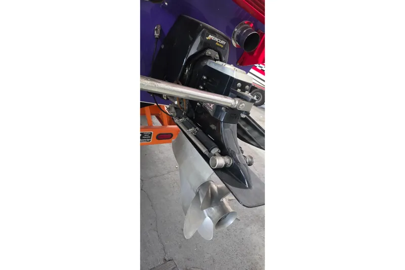 Slide: The Image of Close-up of a 2003 Cigarette 38' Top Gun boat's Mercury engine and propeller. - 27