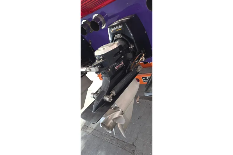 Slide: The Image of Mercury Racing engine on 2003 Cigarette 38' Top Gun boat, showcasing powerful performance. - 26