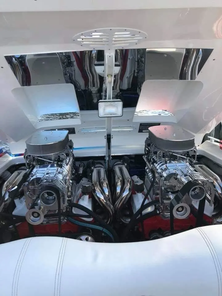 Slide: The Image of The engine compartment of a 2003 Cigarette 38' Top Gun features two powerful engines. - 14