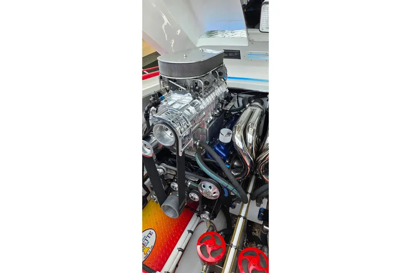 Slide: The Image of Engine of a 2003 Cigarette 38' Top Gun boat, showcasing detailed components. - 22