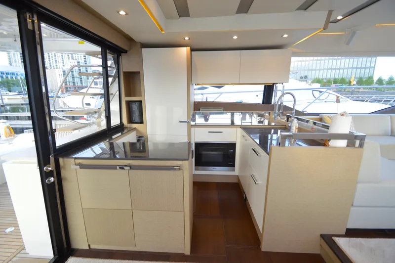 Slide: The Image of The galley of a 2017 Prestige 630 yacht with modern appliances and sleek finishes. - 14