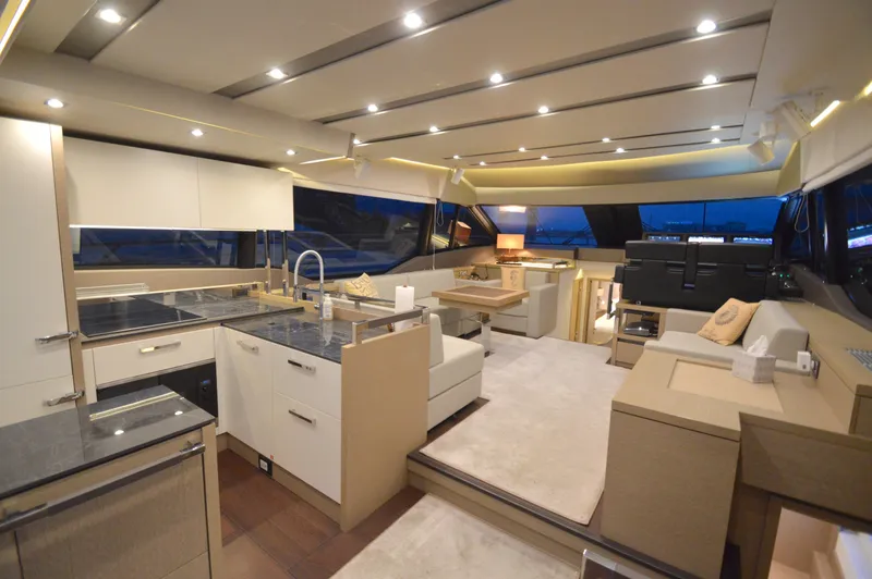 Slide: The Image of Luxurious interior of a 2017 Prestige 630 yacht with modern kitchen and stylish living area. - 1