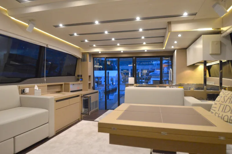Slide: The Image of Interior of a 2017 Prestige 630 yacht with elegant furnishings and large windows. - 40