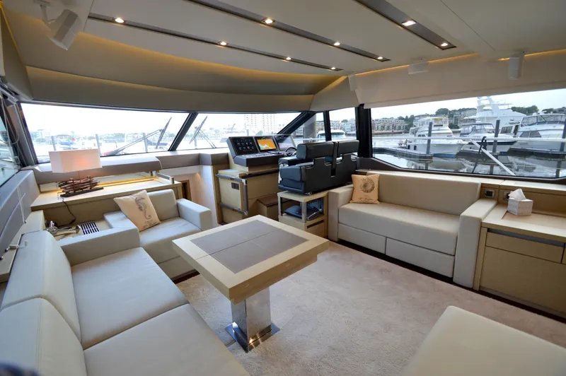 Slide: The Image of Luxurious salon of a 2017 Prestige 630 yacht with elegant sofas and panoramic windows. - 27