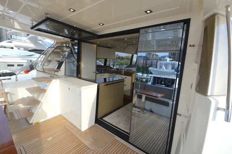 Slide: The Image of The 2017 Prestige 630 features an elegant interior with wood flooring and modern furnishings. - 9