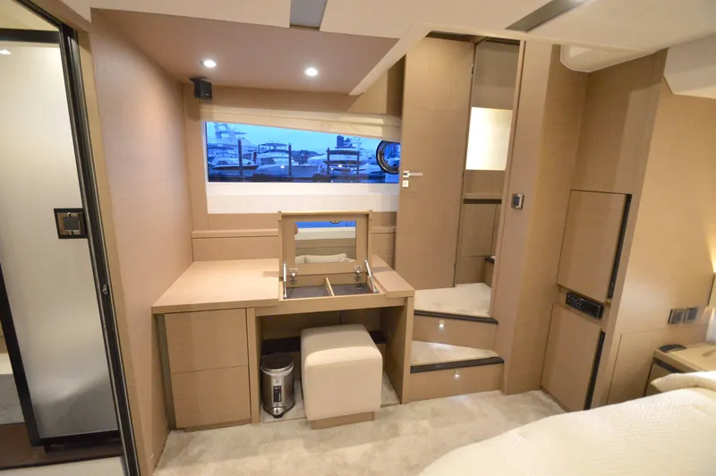Slide: The Image of Interior of a 2017 Prestige 630 yacht with modern design and wood paneling. - 46