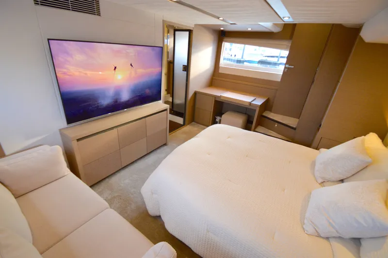 Slide: The Image of Luxurious cabin with a double bed, sofa, and large TV, elegantly furnished. - 47