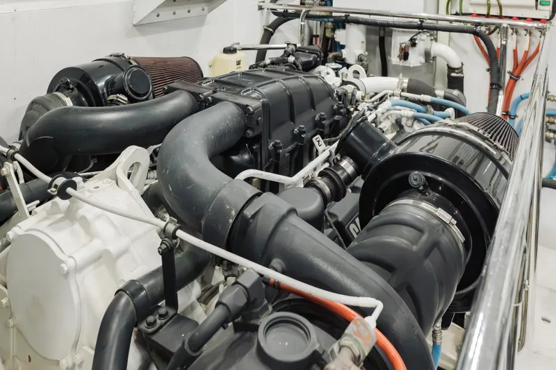 Slide: The Image of Engine room of 2016 Hargrave Flybridge Motor Yacht, showcasing complex machinery and components. - 86