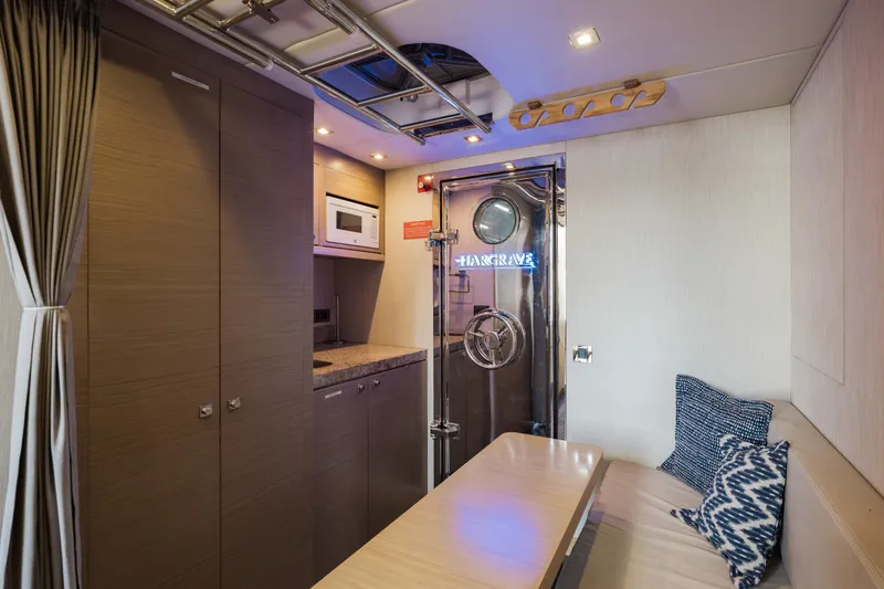 Slide: The Image of Luxurious interior of 2016 Hargrave Flybridge Motor Yacht with modern kitchenette and seating area. - 74