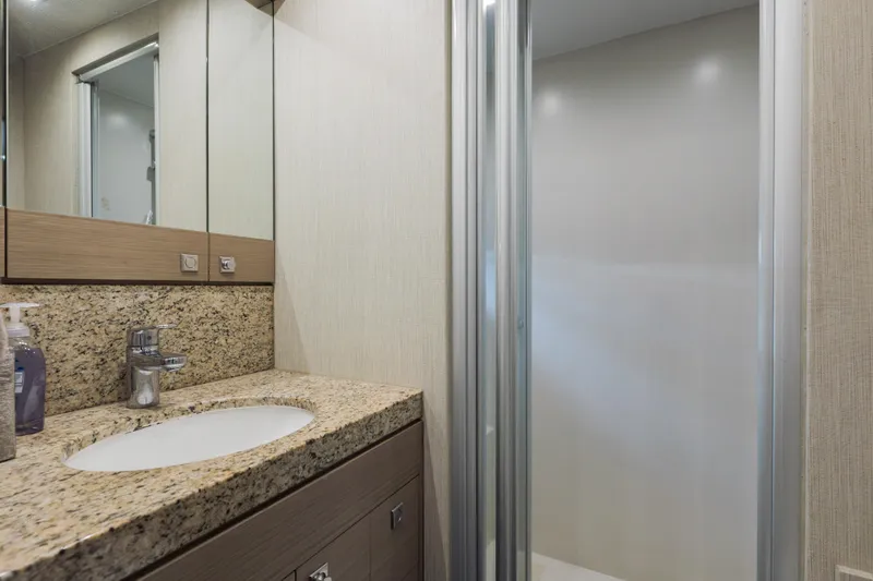 Slide: The Image of Luxurious bathroom on 2016 Hargrave Flybridge Motor Yacht with granite countertop and shower. - 79