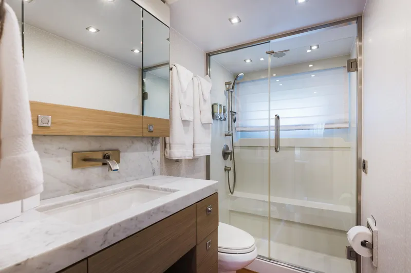 Slide: The Image of Luxurious bathroom in 2016 Hargrave Flybridge Motor Yacht with modern fixtures and marble countertop. - 43