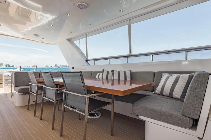 Slide: The Image of Luxurious 2016 Hargrave Flybridge Motor Yacht with elegant outdoor dining area and ocean view. - 62