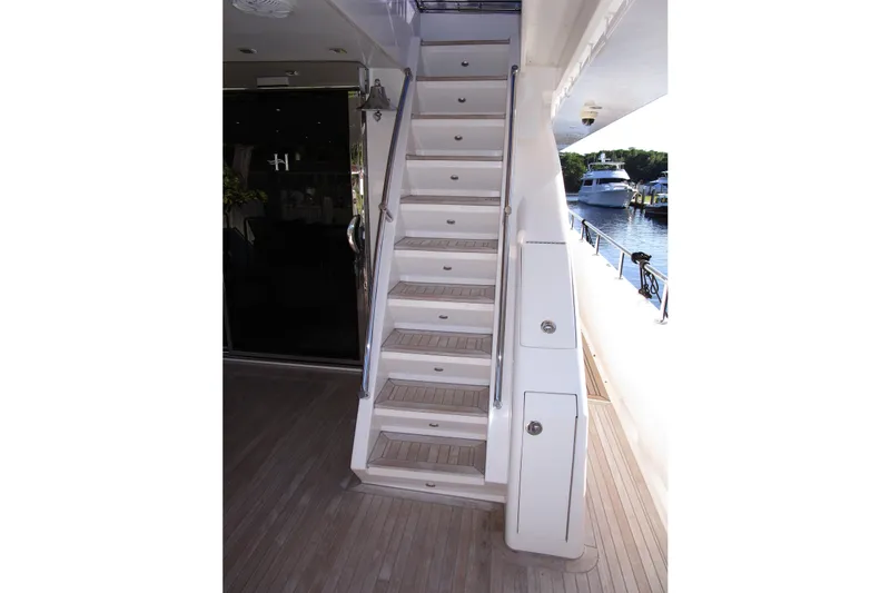 Slide: The Image of Staircase on 2016 Hargrave Flybridge Motor Yacht, leading to upper deck with scenic marina view. - 53