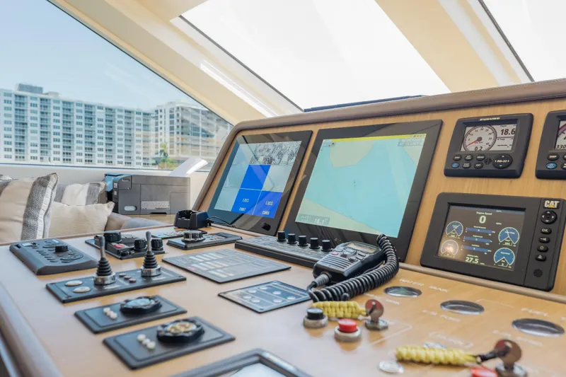 Slide: The Image of Control panel of a 2016 Hargrave Flybridge Motor Yacht with navigation screens and gauges. - 18