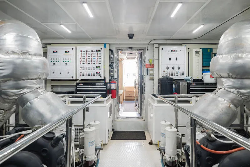 Slide: The Image of Engine room of 2016 Hargrave Flybridge Motor Yacht with control panels and machinery. - 83